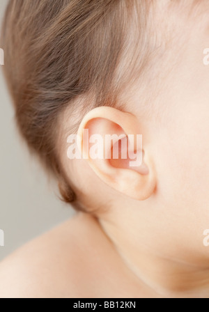 Close up of mixed race baby girl's ear Banque D'Images