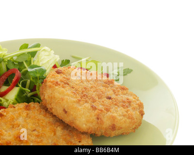 Salmon Fishcakes avec salade de roquette et de Chili Banque D'Images