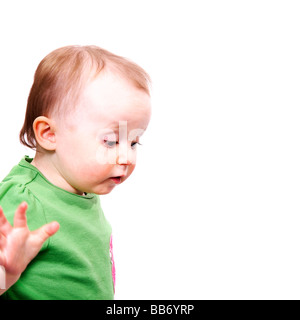 A cute baby girl waving at the camera Banque D'Images