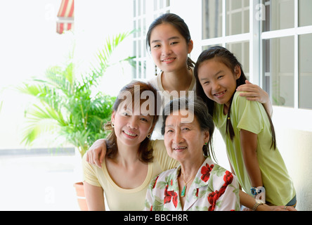 Three generation family, looking at camera, smiling Banque D'Images