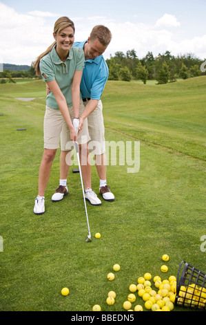 Couple Playing Golf, Burlington, Ontario, Canada Banque D'Images