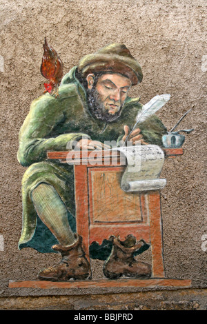 Photo d'un scribe médiéval d'un mur d'un bâtiment à Puy L'Evêque à côté de la rivière Lot, France Banque D'Images