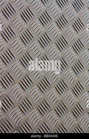 Dans l'acier industriel gaufré design design urbain utilitaires plaque en métal gris couvercle Banque D'Images