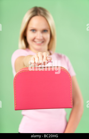 Woman Holding Suitcase Banque D'Images