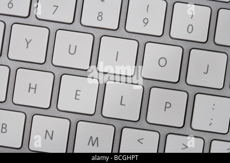 Clavier de l'ordinateur de l'orthographe du mot 'Aide' sur les touches. Banque D'Images