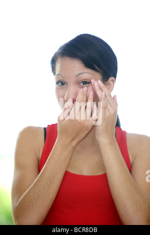 Young woman rubbing her eye model publié Banque D'Images