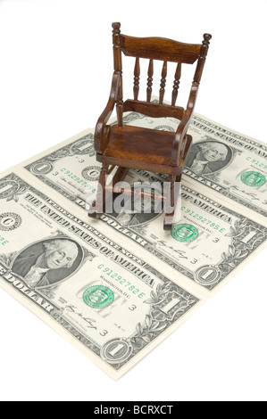 Fauteuil à bascule en bois au sommet d'un Américain one dollar bill Banque D'Images