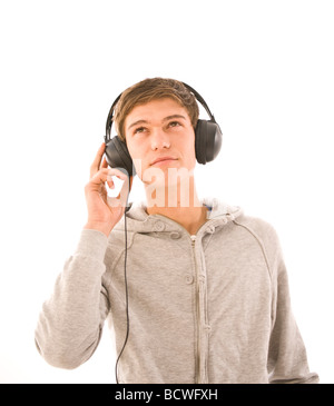 Boy listening to music on headphones Banque D'Images