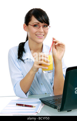 Saft Geschaeftsfrau trinkt junge im Buero young businesswoman jouit de jus d'orange dans le bureau Banque D'Images