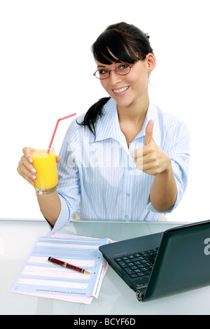 Saft Geschaeftsfrau trinkt junge im Buero young businesswoman jouit de jus d'orange dans le bureau Banque D'Images