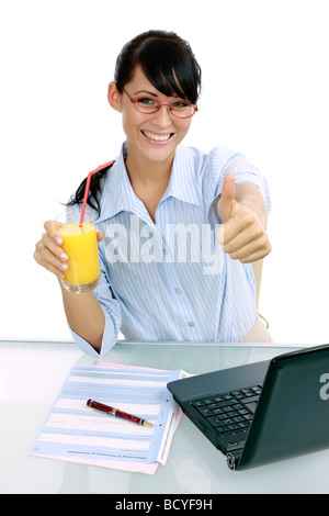 Saft Geschaeftsfrau trinkt junge im Buero young businesswoman jouit de jus d'orange dans le bureau Banque D'Images