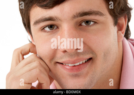 Studio Portrait Of Smiling Teenage Boy Banque D'Images