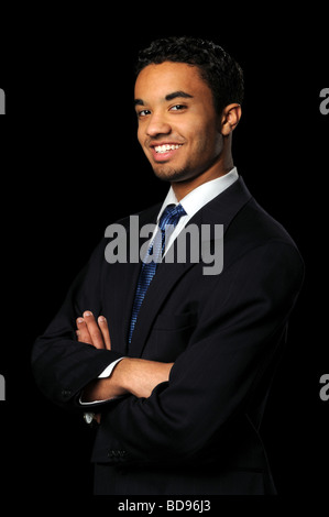 Portrait of young businessman sur un arrière-plan noir Banque D'Images