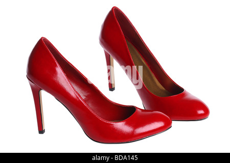Hautes chaussures de talon rouge sur fond blanc Banque D'Images