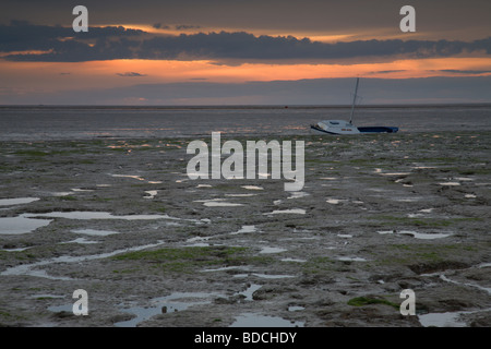 La paisible plage de King's Lynn au coucher du soleil à Norfolk, Angleterre, Royaume-Uni. Banque D'Images