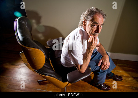 High angle view of serious man sitting in chair Banque D'Images