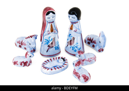 Crèche de figurine de verre isolé sur blanc. Banque D'Images