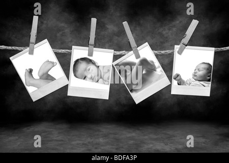 Les photographies en noir et blanc accrochés sur une corde par un linge sur Grunge Background Banque D'Images