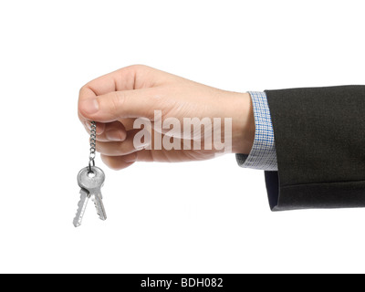 Un business man holding un jeu de clés. Banque D'Images