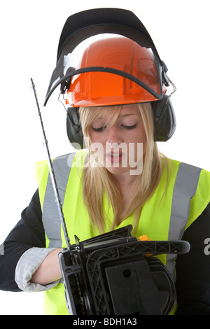 Les jeunes 20 ans blond woman wearing hard hat orange protège-oreilles et des pare-soleil vis vest Banque D'Images