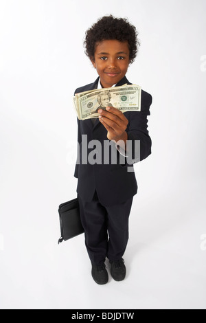 Boy Holding Money Banque D'Images