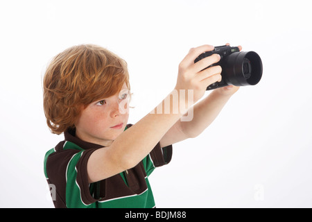 Boy Holding Camera Banque D'Images