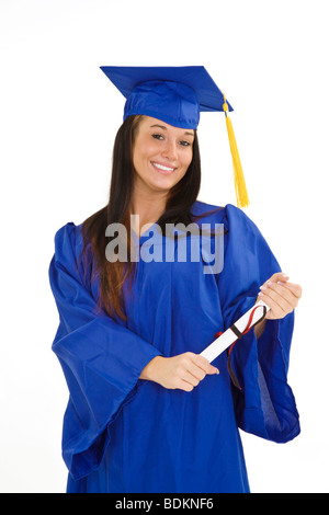 Une belle Caucasian teenager dans une graduation gown on a white background Banque D'Images