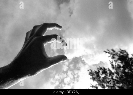 Toucher un nuage Banque D'Images