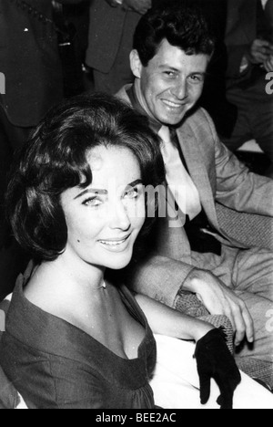 Liz Taylor et son mari Eddie Fisher s'asseoir à une partie Banque D'Images