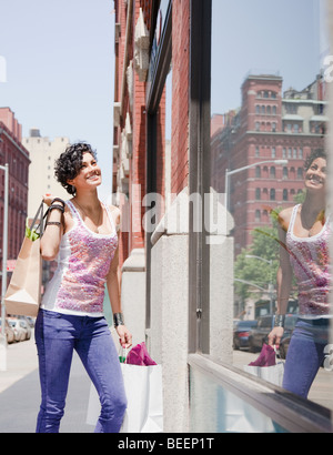 Mixed Race woman on urban street Banque D'Images