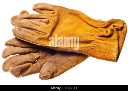 Vieux grungy gants de travail isolé sur fond blanc Banque D'Images