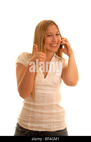 Dix-huit ans avec un téléphone mobile et de Thumbs up Banque D'Images