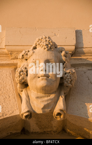 Visage chérubin sur mur au coucher du soleil, des Zattere, Dorsoduro, Venise, Italie Banque D'Images