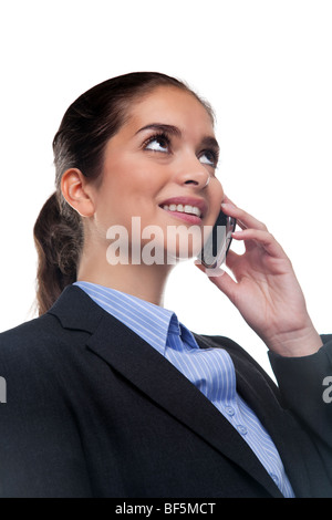 Businesswoman chatting sur son téléphone portable Banque D'Images