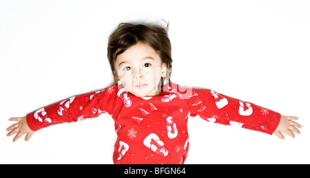 Portrait of boy wearing red Christmas pyjama Banque D'Images