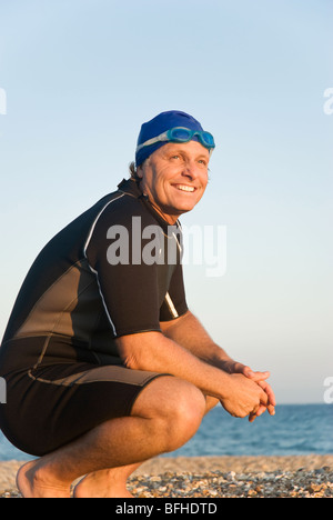 Un portrait couleur d'un rire heureux nageur ou triathlète. Banque D'Images