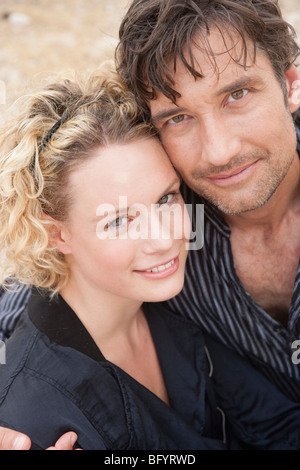 Couple smiling at viewer