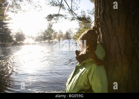 Woman outdoors in winter landscape Banque D'Images