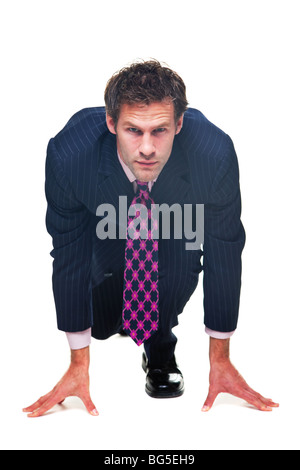 Businessman dans une position de départ, isolé sur un fond blanc. Banque D'Images