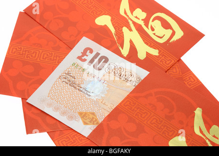 Le nouvel an chinois et les paquets rouge Bristsh notes Banque D'Images