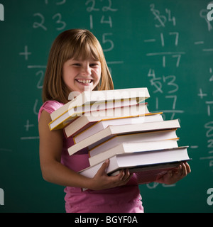 Young student holding books Banque D'Images