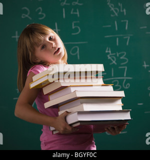 Young student holding books Banque D'Images