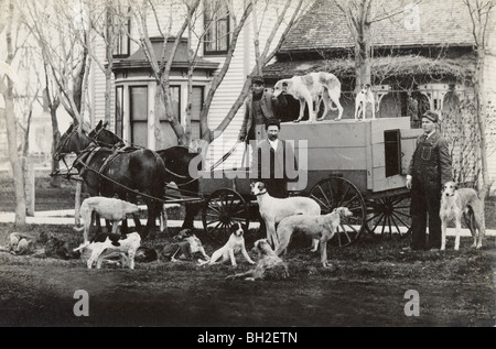 Trois Dogcatchers avec Dogcatcher Wagon & leur carrière Banque D'Images