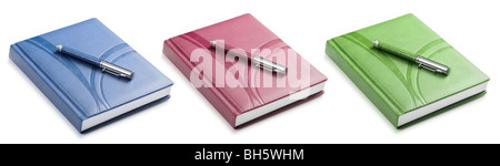 Set stylo et un bloc-notes de couleur. Une photo close up Banque D'Images