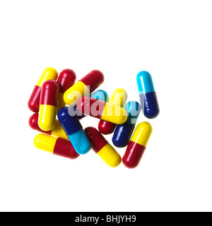 Bleu, rouge et jaune des capsules de la grippe sur un fond blanc Banque D'Images