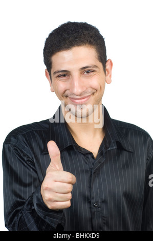 Jeune homme donnant un Thumbs up against a white background Beyrouth Liban Moyen-Orient Asie Banque D'Images