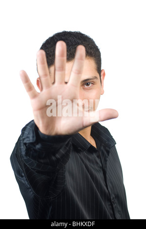Jeune homme montrant la main, comme un geste d'arrêt contre un fond blanc découpe Beyrouth Liban Moyen-Orient Asie Banque D'Images