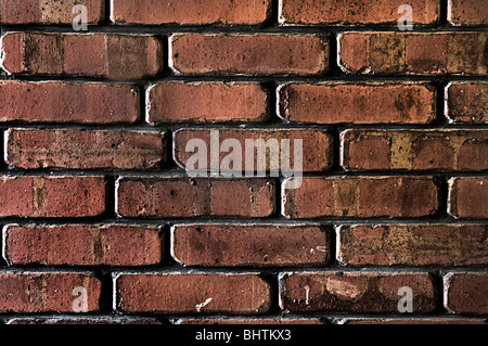 Mur de brique de style grunge montrant beaucoup de texture. Banque D'Images
