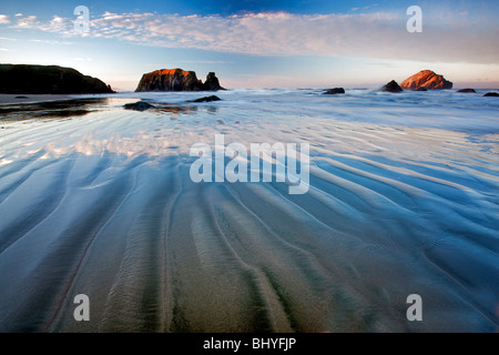 Marée basse et le lever du soleil à Bandon beach. Oregon Banque D'Images