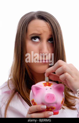 Woman with piggy bank in hand Banque D'Images